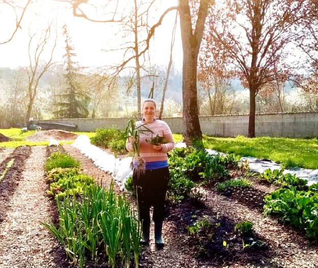 Leanne amongst the garden beds